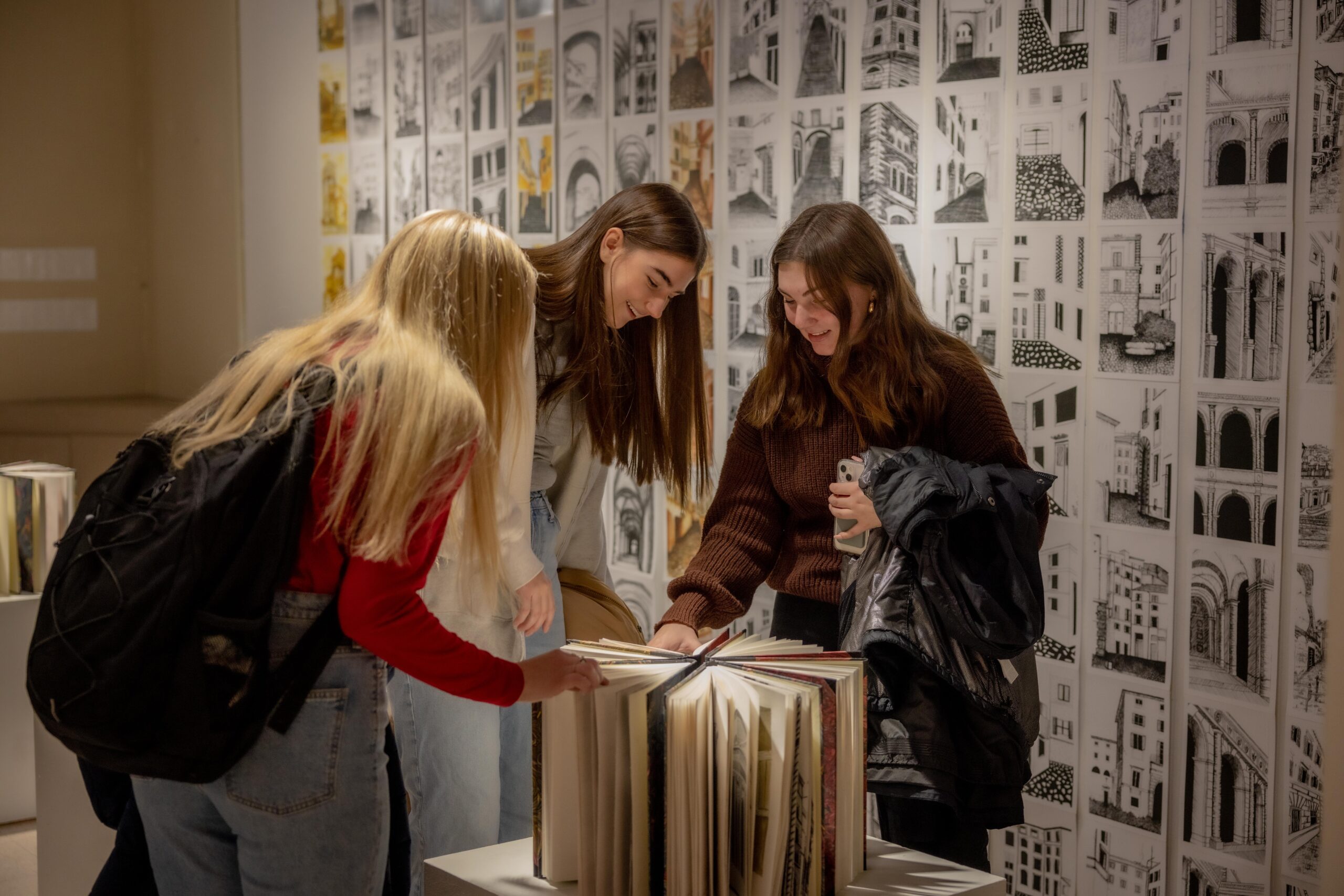 Students exploring an exhibition held in Gallery 181.