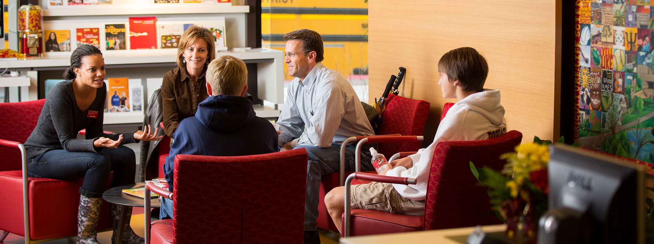 A prospective student and their family talk with an Iowa State University admissions representative.