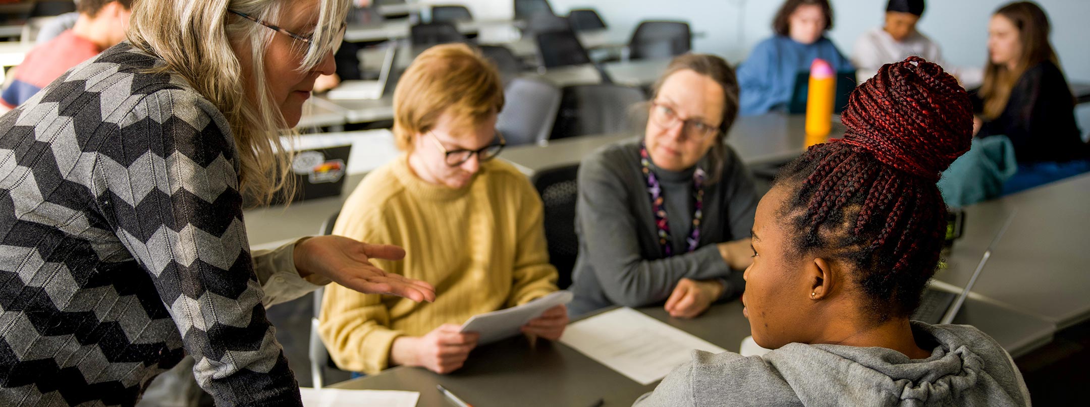 Professor working with student.