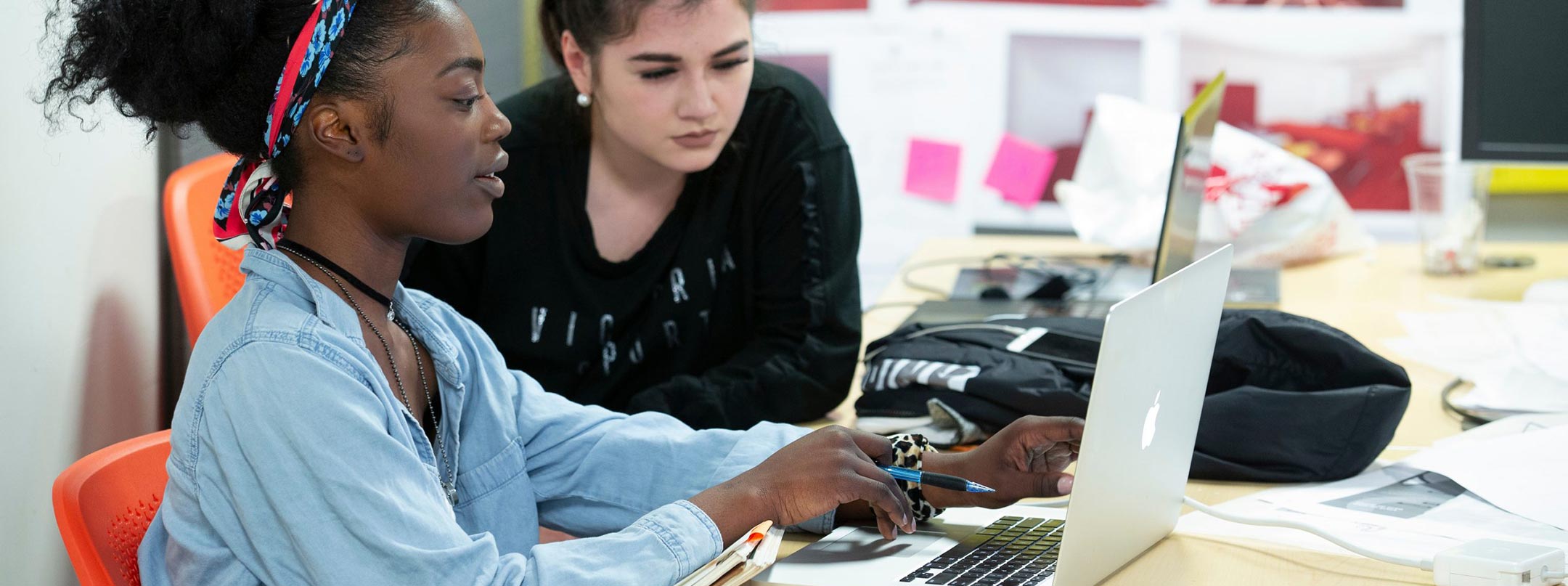 Two students working on project.