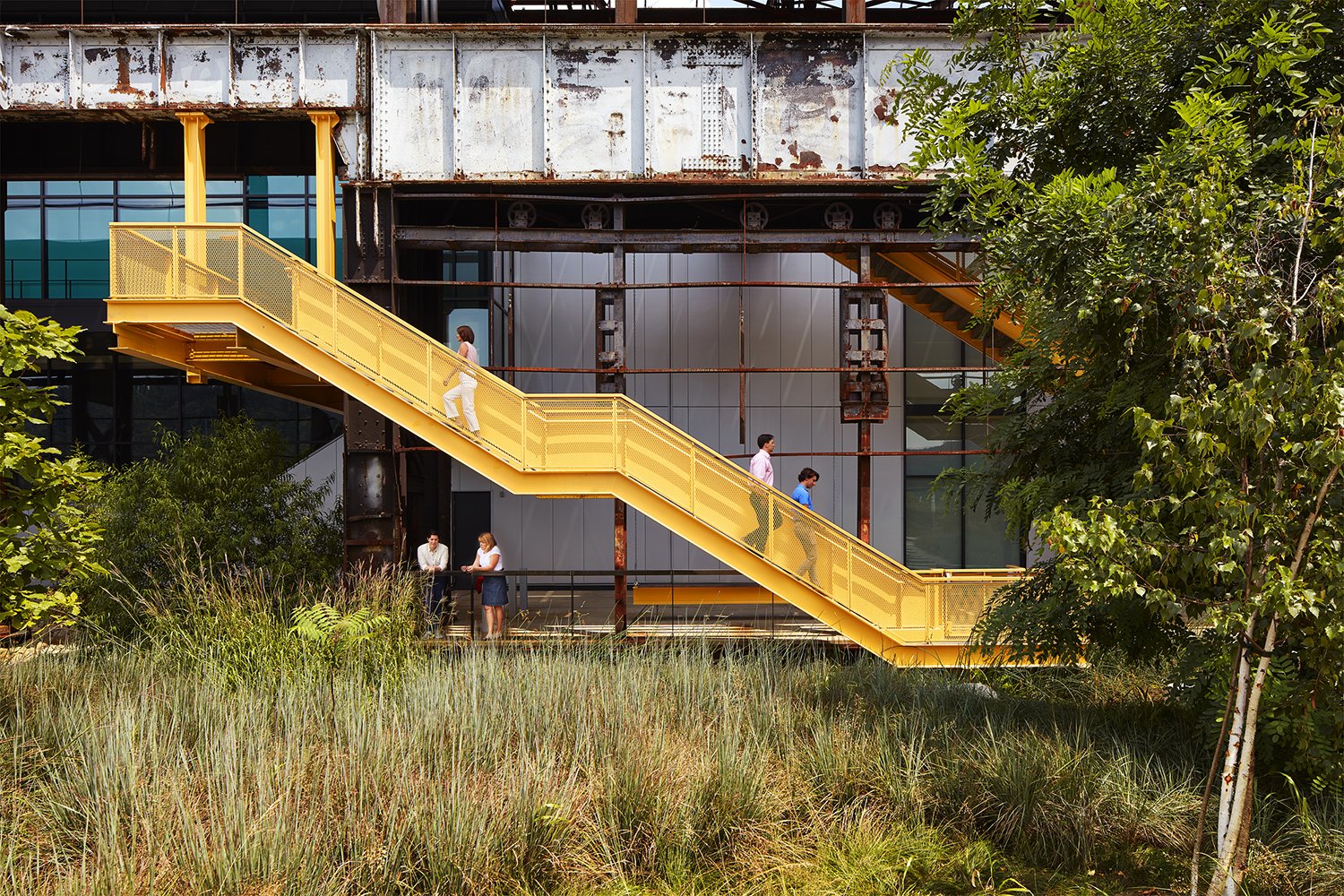 TEN X TEN Mill 19 Project, people walking up and down yellow stairs