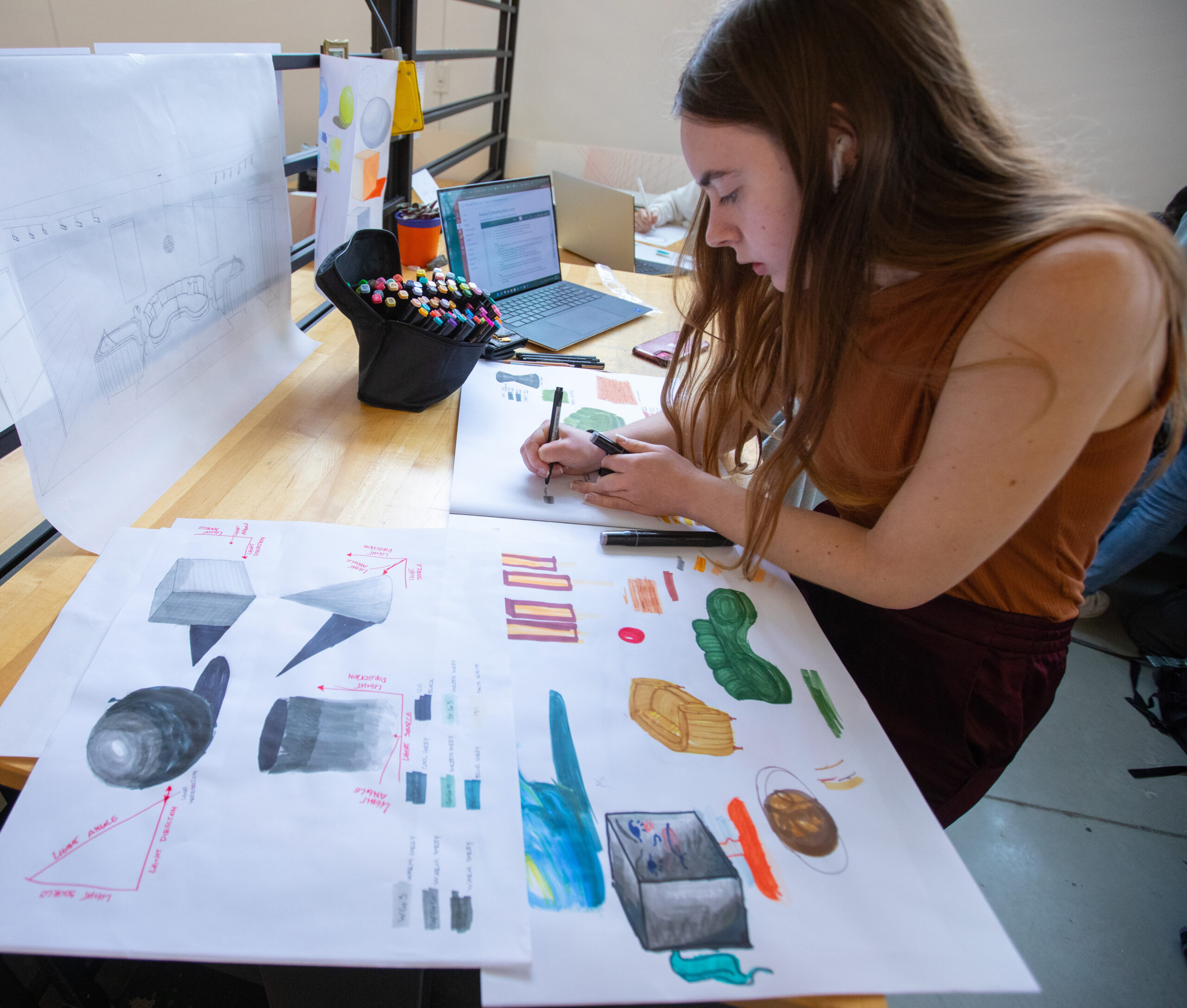 Female student working on graphic design drawing